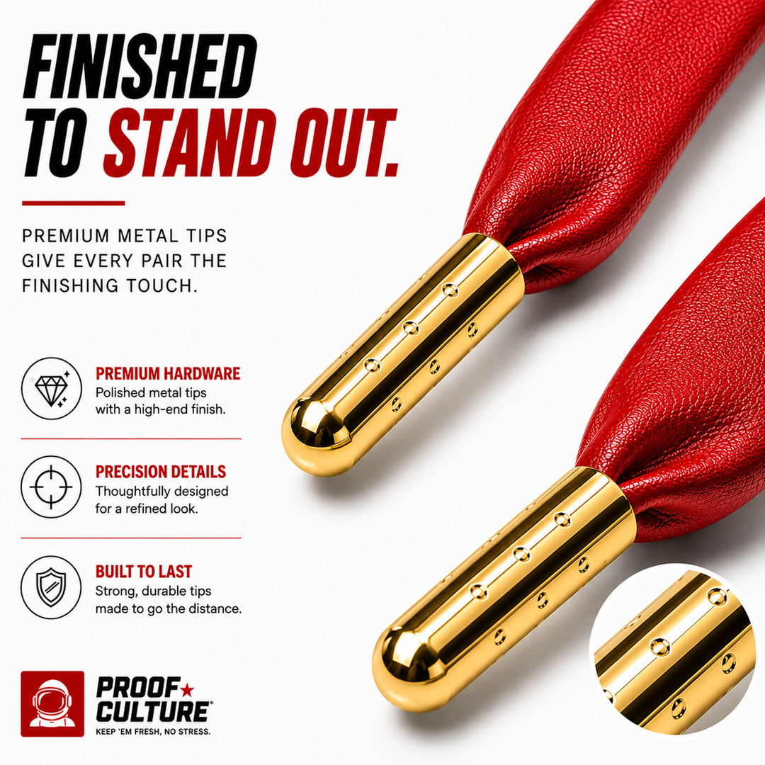 Black faux leather laces with gold metal tips, close-up