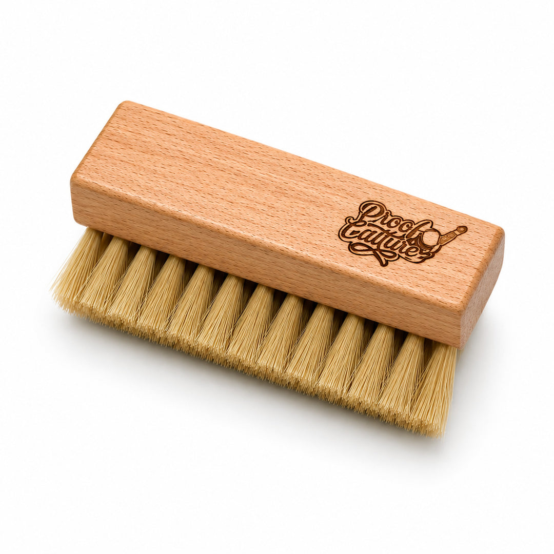 Proof Culture wood-handled sneaker brush with medium tan bristles, product shot on white background
