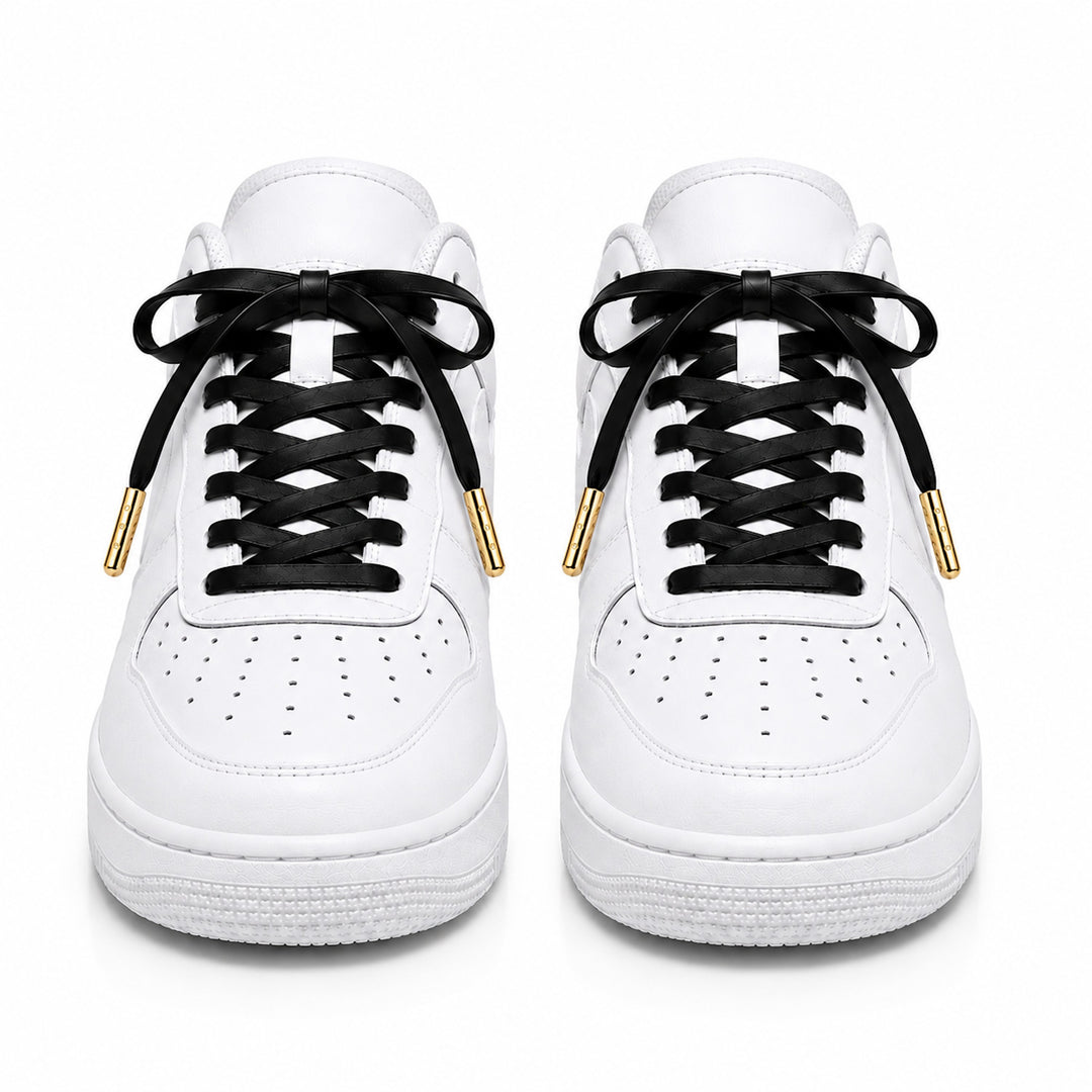 Black faux leather laces with gold metal tips