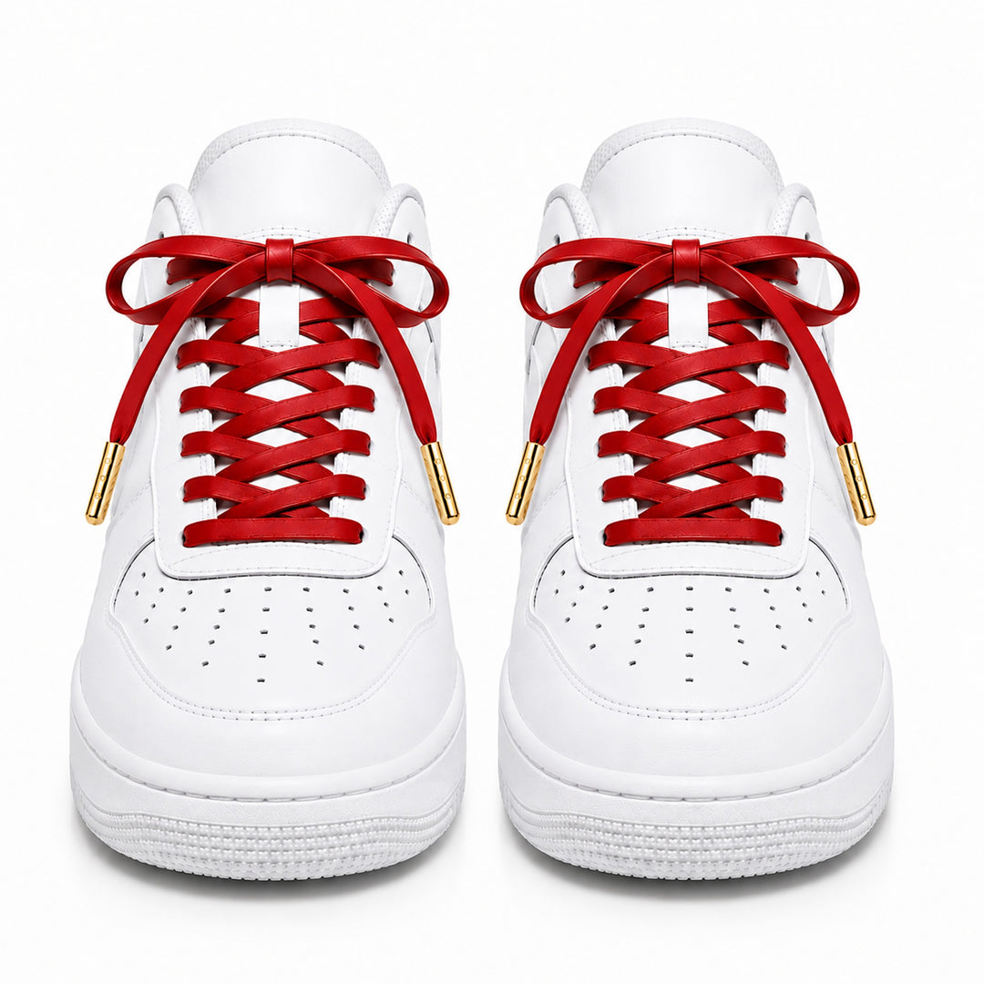 Red faux leather laces with gold metal tips